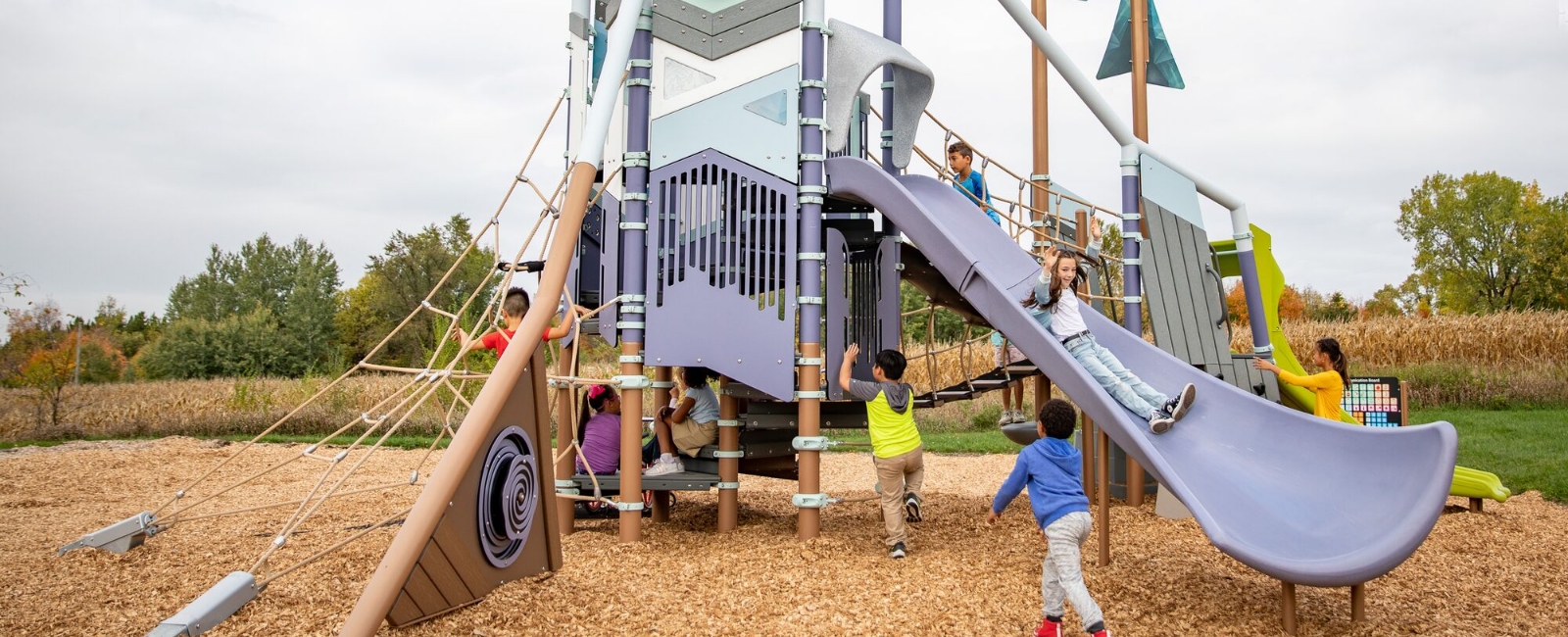 kids playing on colorful playground equipment